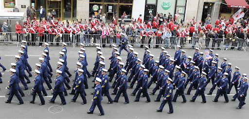Picture showing people marching in a parade